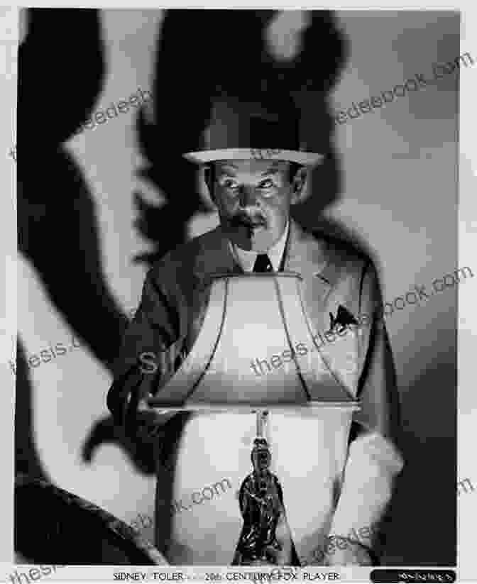 Sidney Toler In Character As Charlie Chan, Wearing A Suit And Smoking A Pipe Charlie Chan At The Movies: History Filmography And Criticism